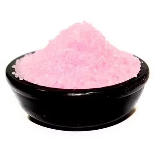 Close-up of jasmine scented granules in a white bowl with a soft floral background for Jasmine Simmering Granules product