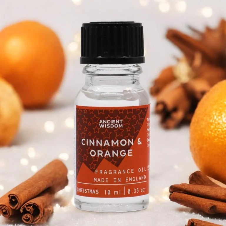 10ml bottle of cinnamon orange essential oil in a festive Xmas-themed dark glass vial