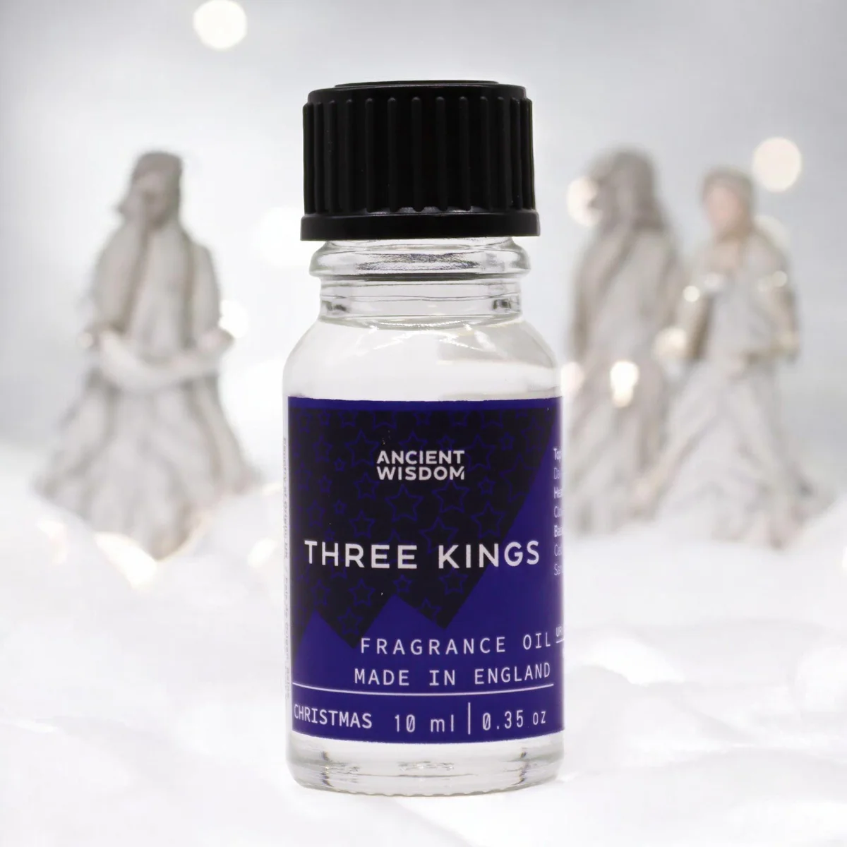 Clear glass 10 ml bottle of Three Kings oil with silver cap and label.