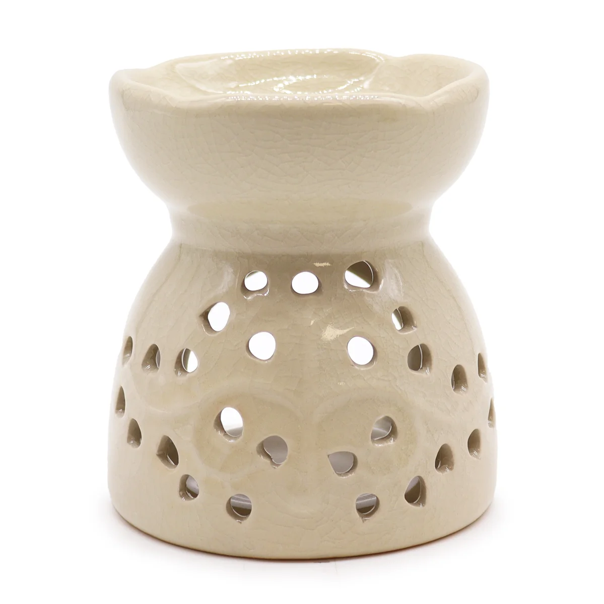 Ivory Tree of Life oil burner decor featuring a branching silhouette on a sun‑lit tabletop