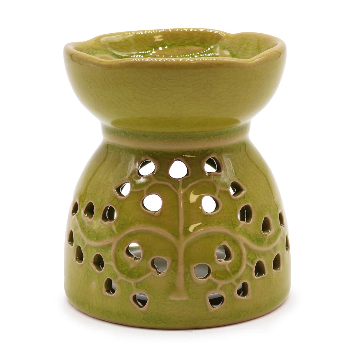 Lime tree of life oil burner set on a white background, stylised branches and central trunk, part of tree of life decor.