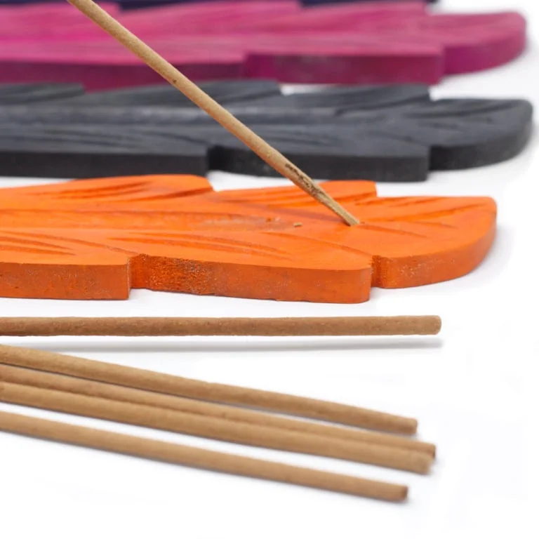 Leaf shaped ash catcher made from mango wood, 10 inches tall, shown in photo