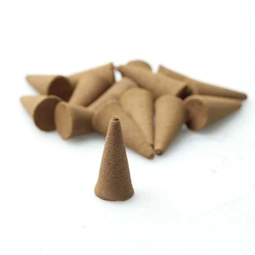 Raw incense cones displayed in a bulk 5kg pack, showing various small cones ready for use.