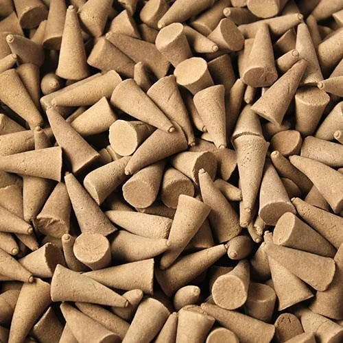 Bulk raw incense cones neatly stacked in a 5kg pack.