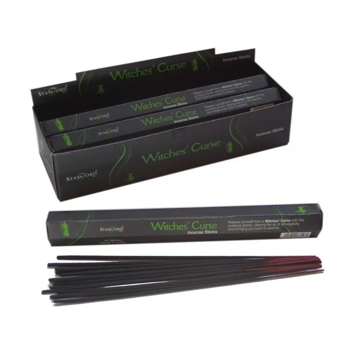Stack of witch's curse incense sticks in a wooden holder, bundled with kraft paper, ready for aromatic experience.
