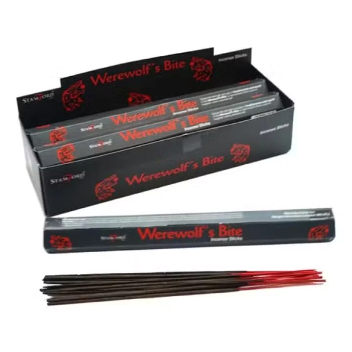 Ardent werewolf incense sticks arranged in a small stack, bundled with twine.