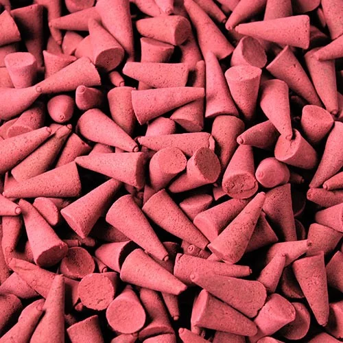 Bulk apple cinnamon incense cones displayed on a neutral background.