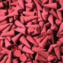 Bulk incense cones in a compact stack, labeled Dragons Blood, ready for use.
