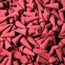 Bulk of fresh incense cones in soft white packaging, labeled Dragons Blood incense, ready for burning.