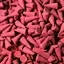 Batch of bulk dragons blood incense cones arranged in a stack.