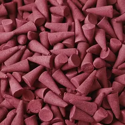 Stack of opium incense cones in bulk, showing cone shapes, light brown packaging.