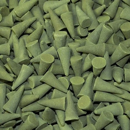 Bulk incense cones stacked casually on a neutral background.