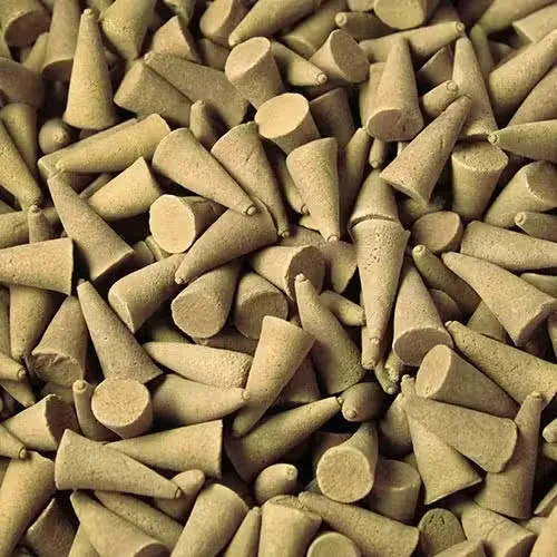 Coconut incense cones bulk displayed on a flat surface.