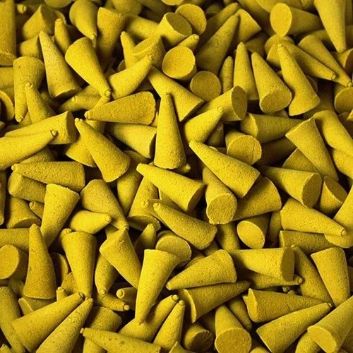 Stack of lemon incense cones on a tray, arranged neatly and ready for use.