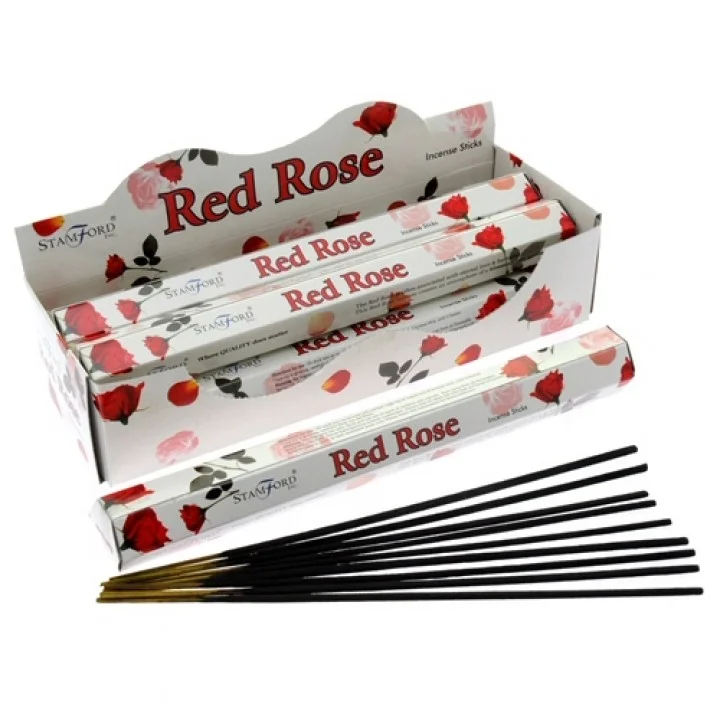 Red incense stick, rose scented, bundled in a simple holder.