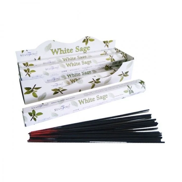 Premium white sage incense sticks laid out on a white background