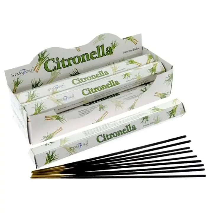 Stacks of premium citronella incense sticks arranged on a white background