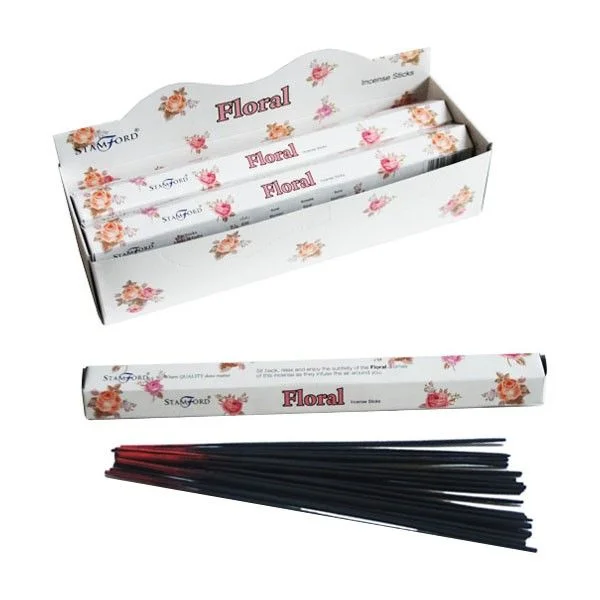 Floral incense sticks displayed in a simple arrangement.