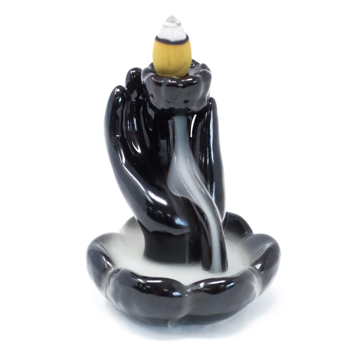 Backflow incense holder featuring hand shape and lotus flower design, a decorative ceramic incense burner.