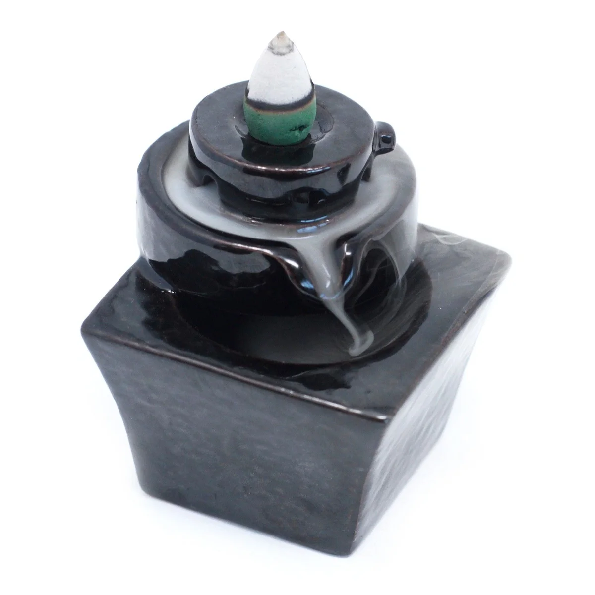 Backflow incense burner with round base that transitions into a square burner surface.