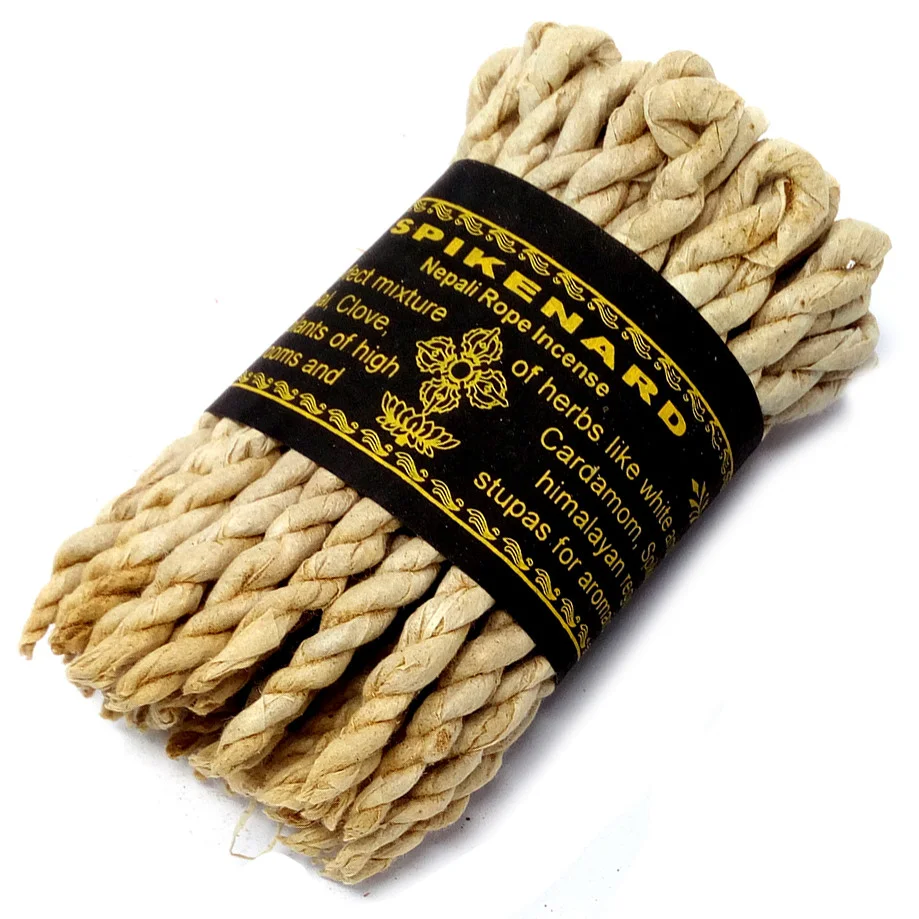 A roll of spikenard rope incense, shown on a wooden surface, ideal for the UK market.