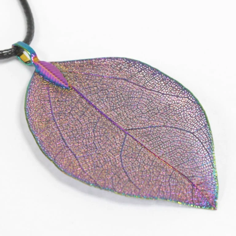 Multicoloured bravery leaf necklace laid on a light background
