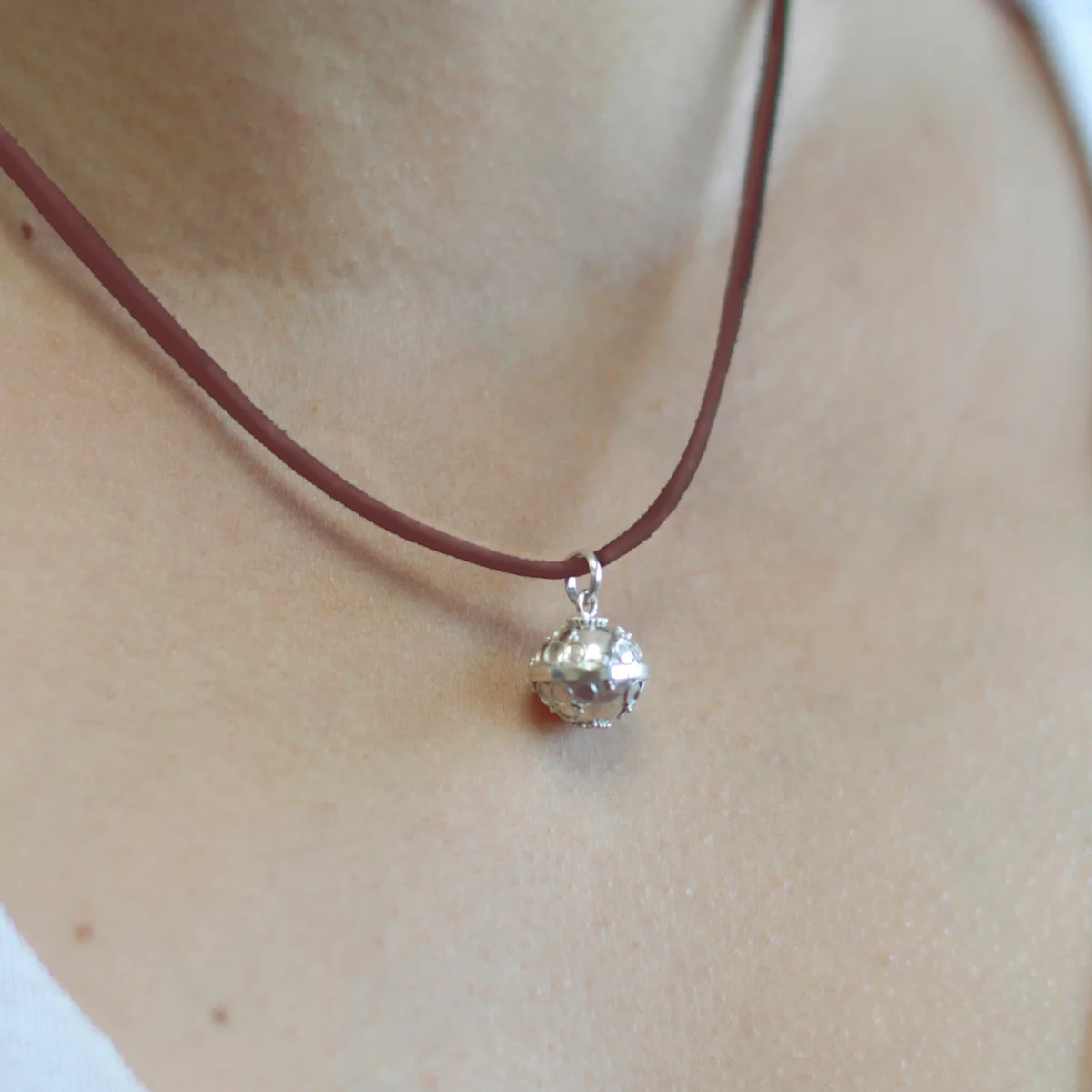 Silver angel bell decor, 12mm, featuring a faith‑inspired silver angel.