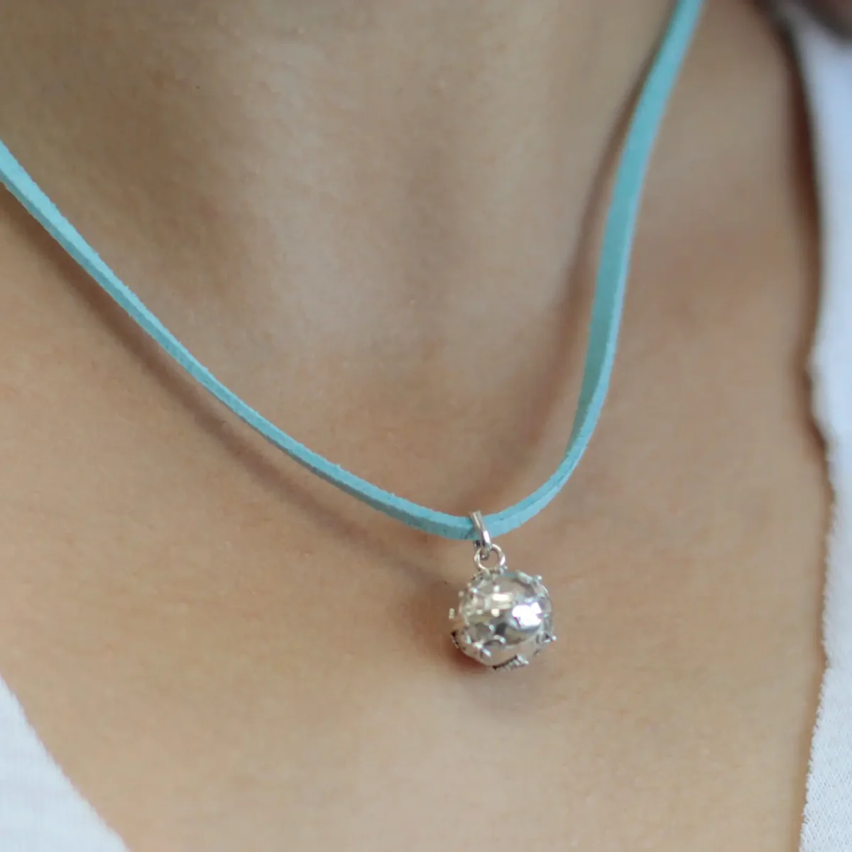 Silver angel bell ornament, 12 mm, smooth finish, small angel silhouette, classic graceful design.