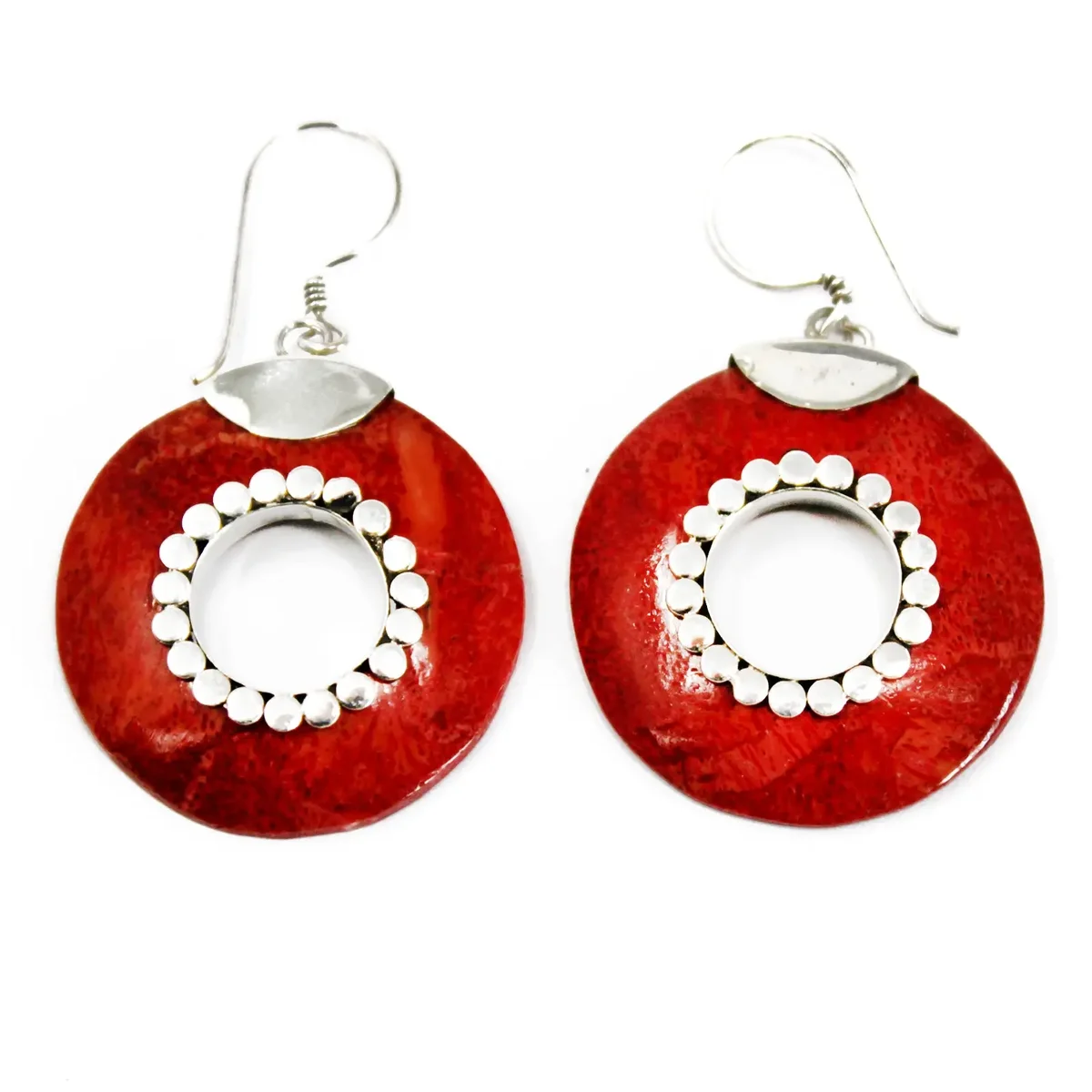 silver donut earrings displayed side by side, each a circular shape with a central hole on a white backdrop.
