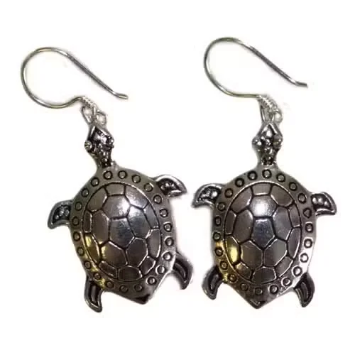 Set of sleek silver turtle earrings arranged on a neutral background, showcasing classic silver turtle jewellery.