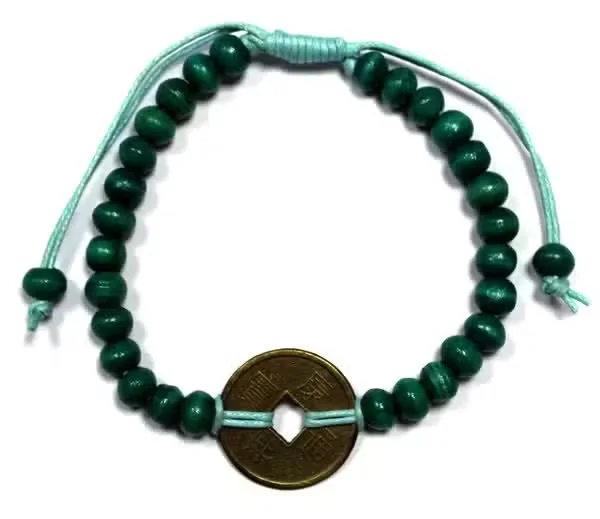 Green luck bracelet with feng‑shui charm, stylish accessory for good fortune.