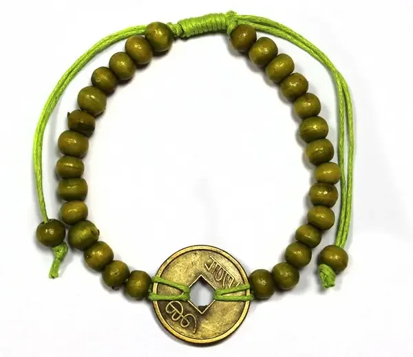 Lime green good luck bracelet with a feng shui design.
