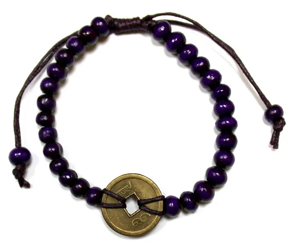 Purple Feng-Shui bracelet with good luck charm.