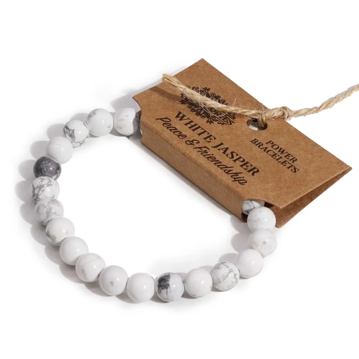 White jasper bracelet displayed on a smooth surface, showcasing a simple, elegant chain design.