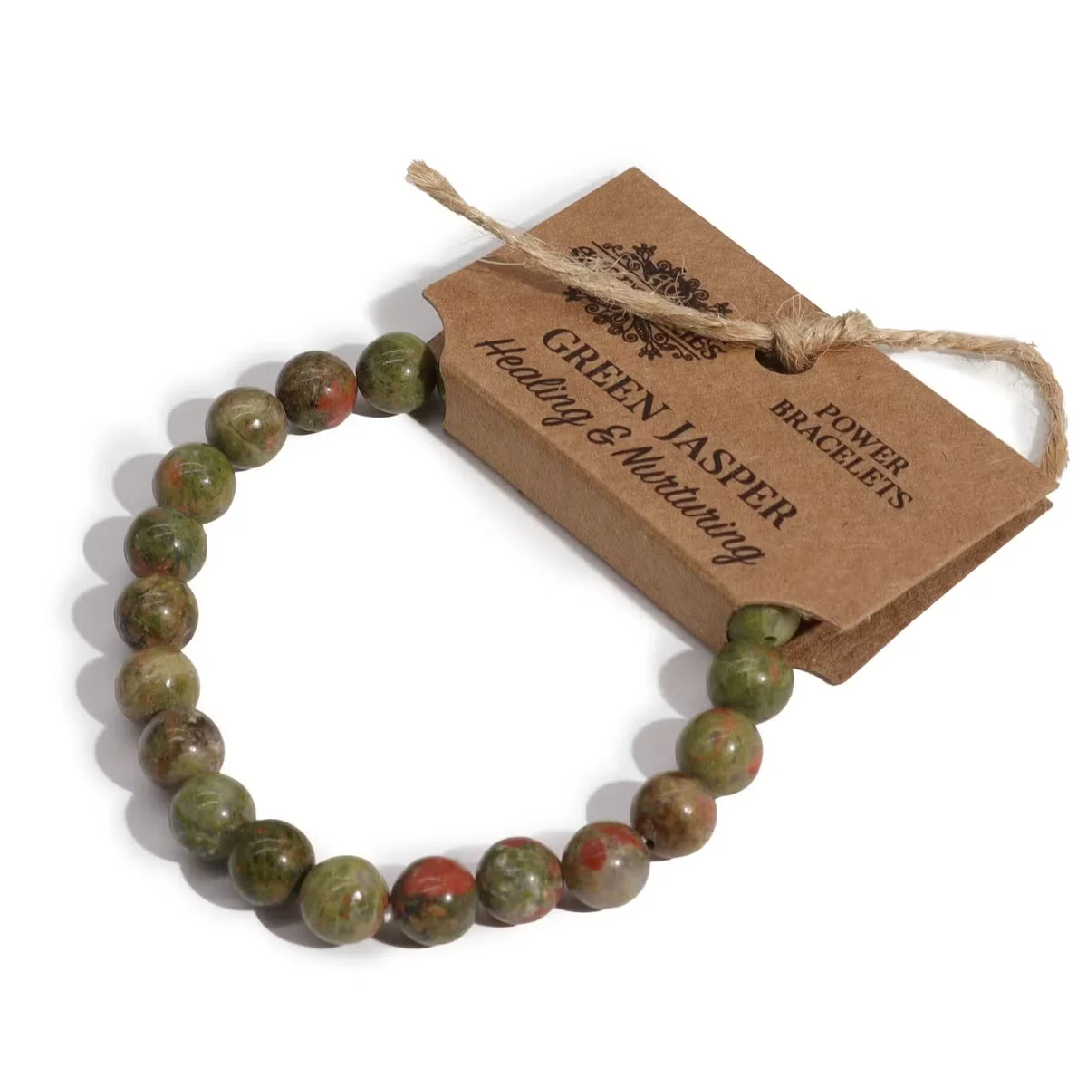 Green jasper bracelet with carved stone details on a delicate metal band, showcasing a green jasper accessory