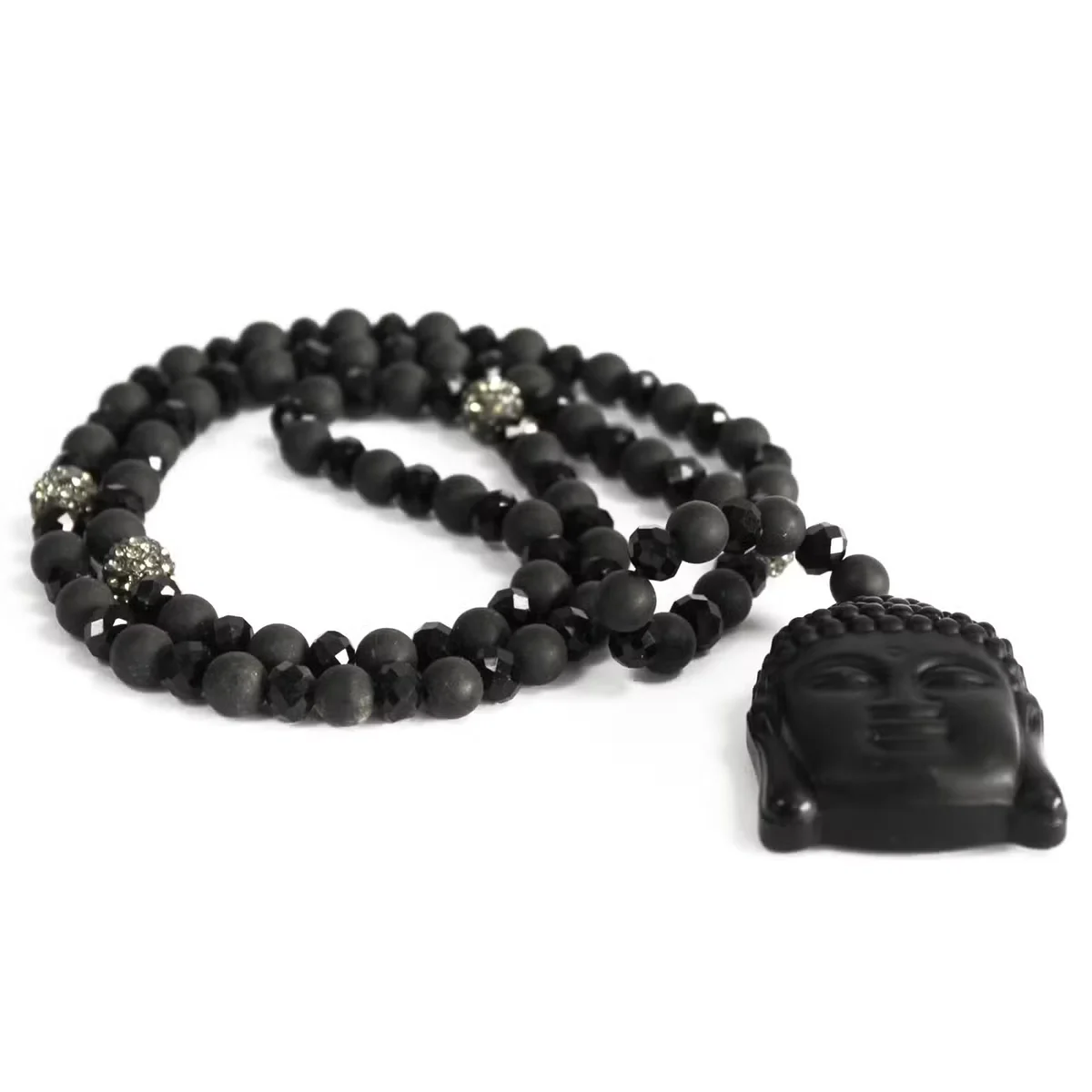 Buddha figurine wearing a black stone gemstone necklace.