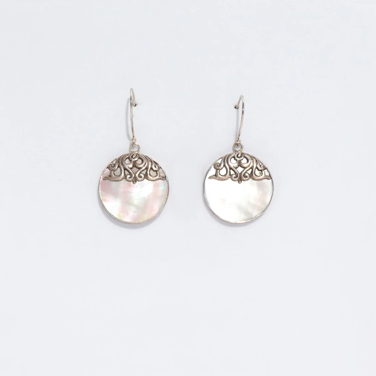 Silver disc earrings featuring shell inlay, classic design