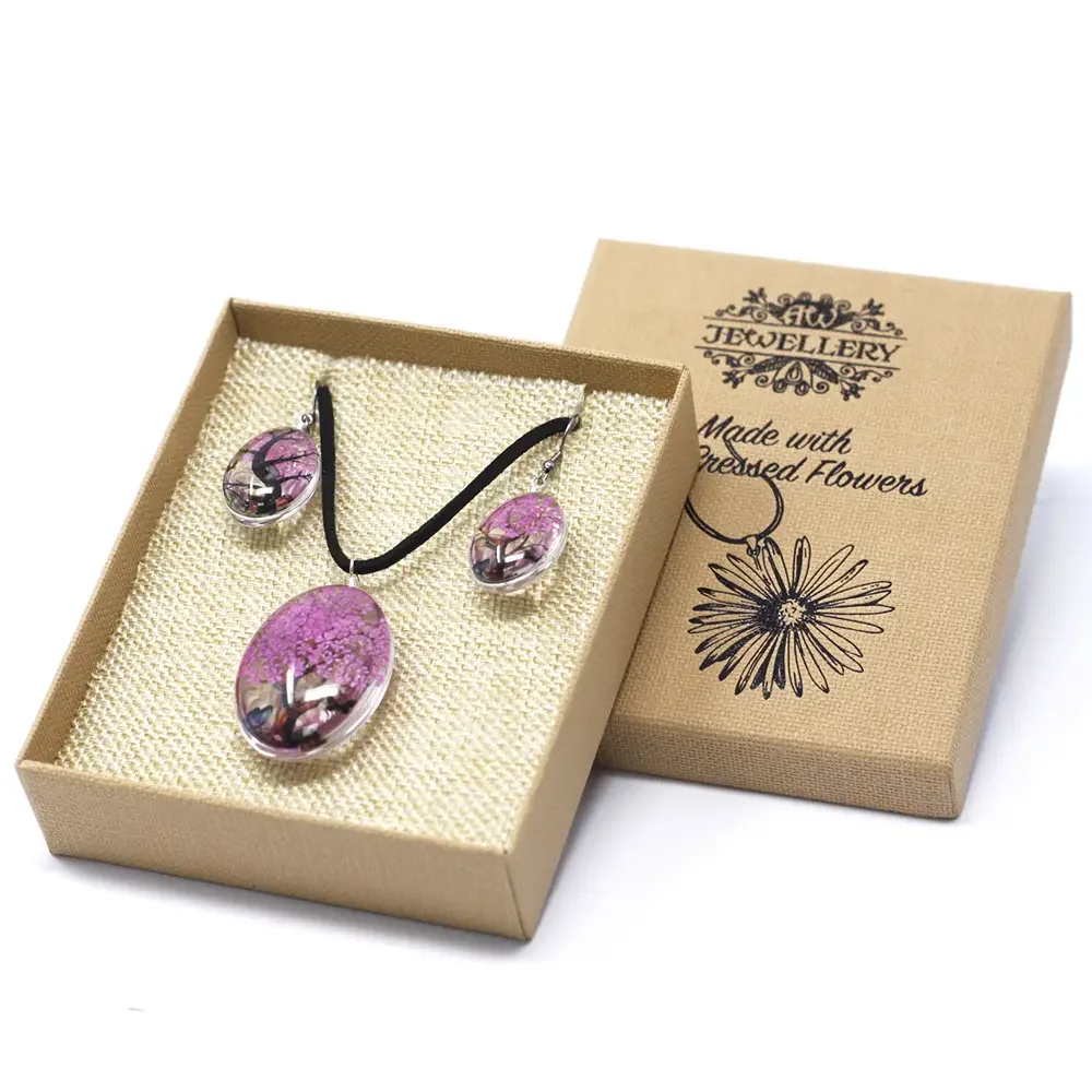 Pressed flowers decor featuring a bright pink tree of life arrangement