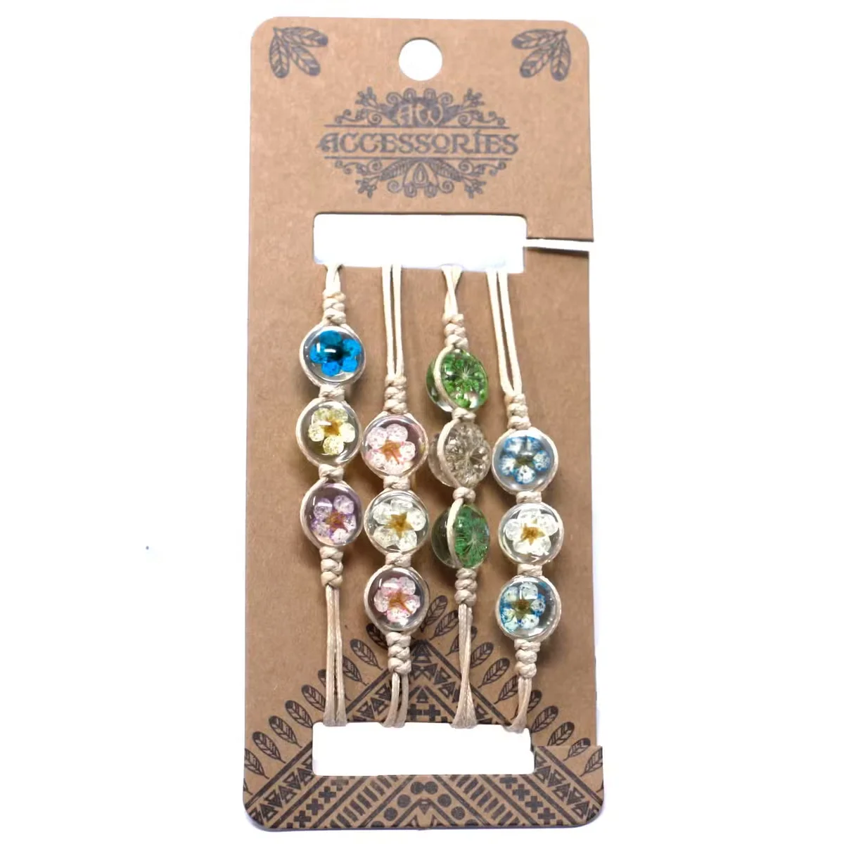 Pressed flower bracelet displaying three pressed blooms on a polished band.