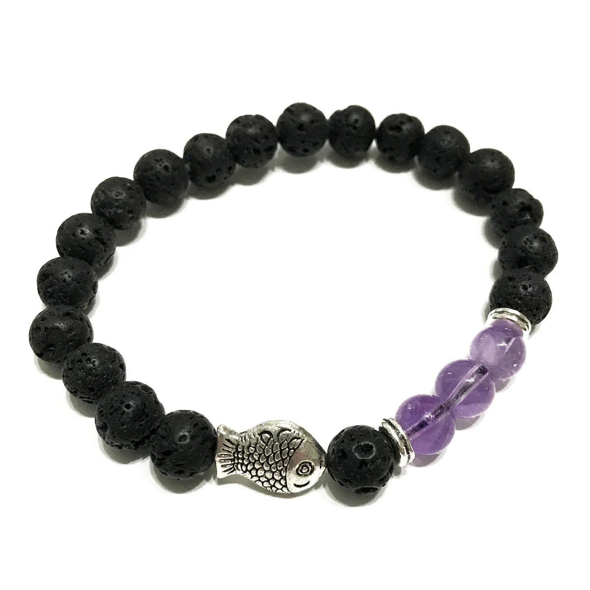 Fish-shaped amethyst pendant hanging from a lava stone jewellery bracelet.