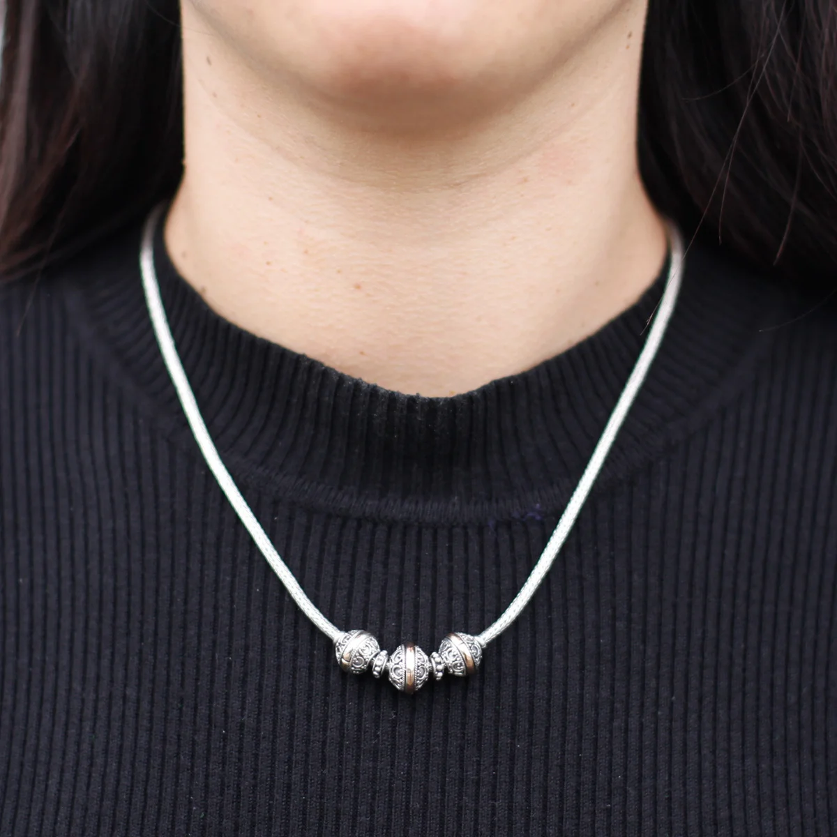 Triangular silver and gold mixed metal necklace.