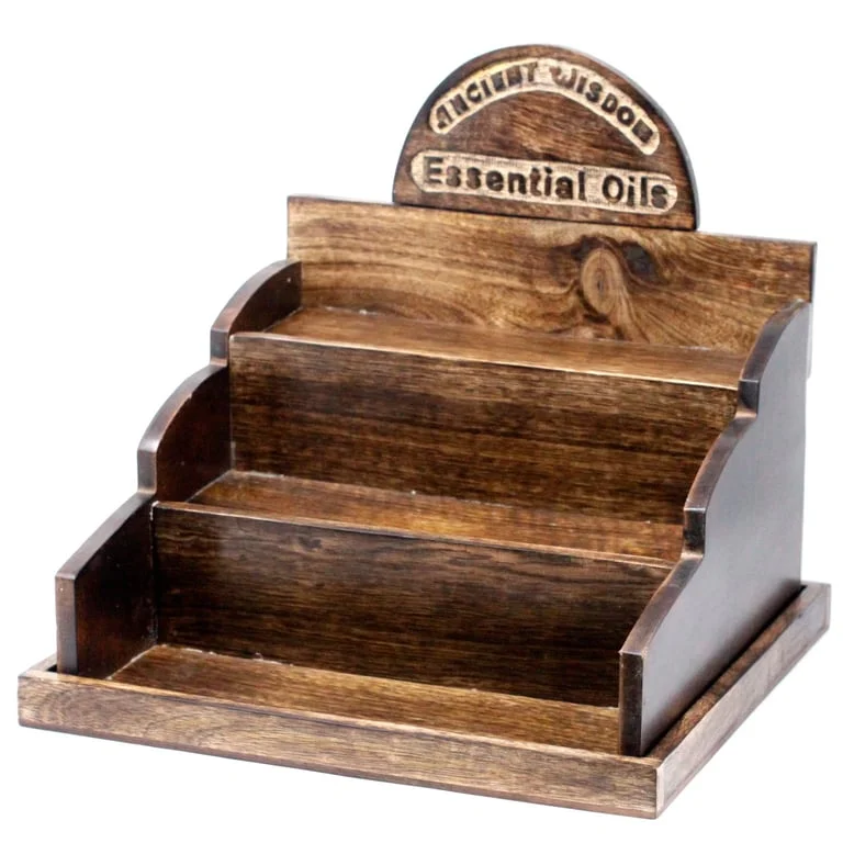 Mango wood stand for fragrance oils, wooden surface and bottle holder visible.