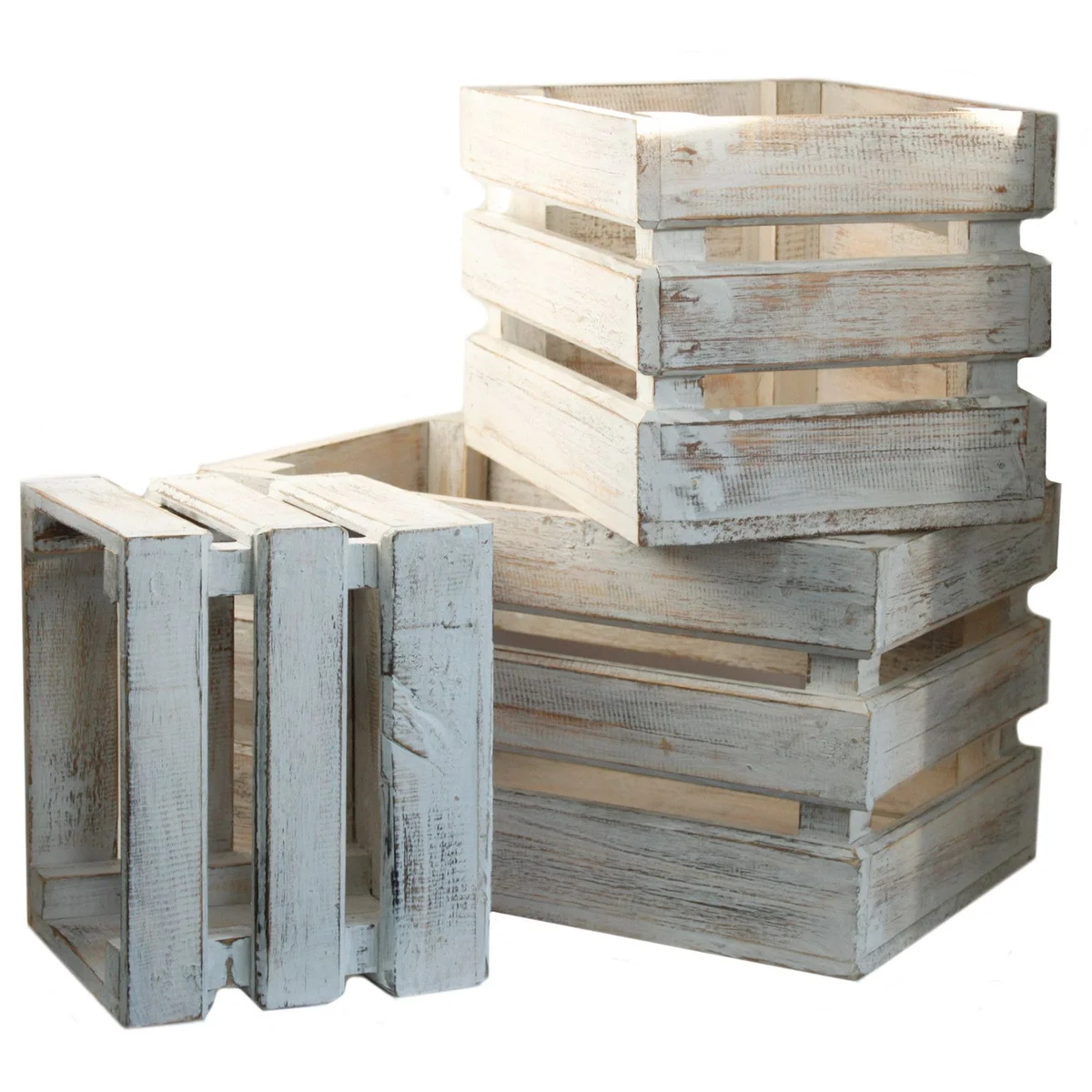 Set of three whitewash storage crates made of wood, stacked on a wooden shelf