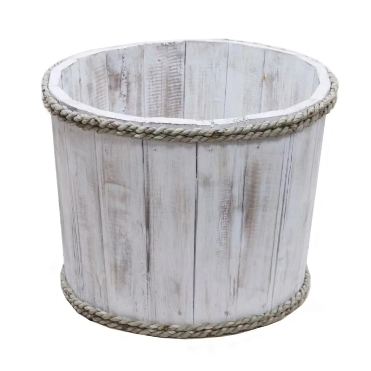Front view of a small wooden tub finished in whitewash, offering a simple rustic storage option.