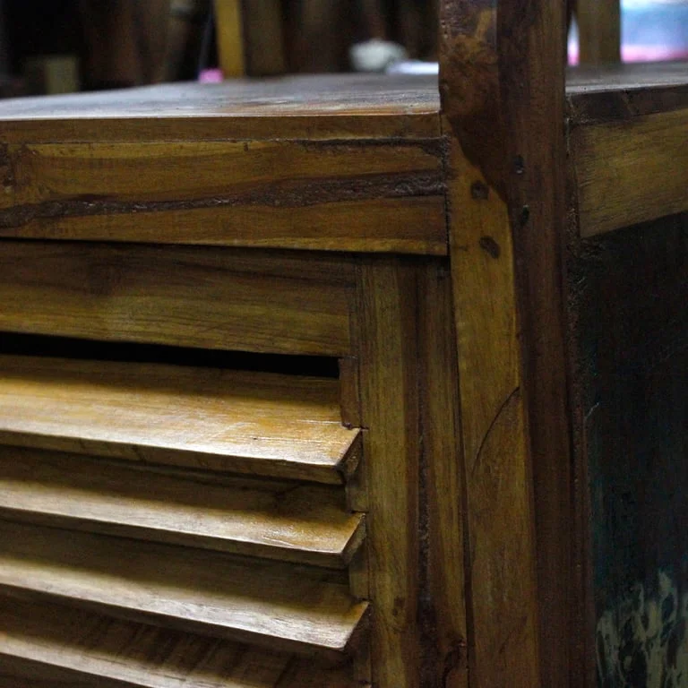 Recycled wood shelf display made of teak, shown in a modern interior with natural light and simple décor.