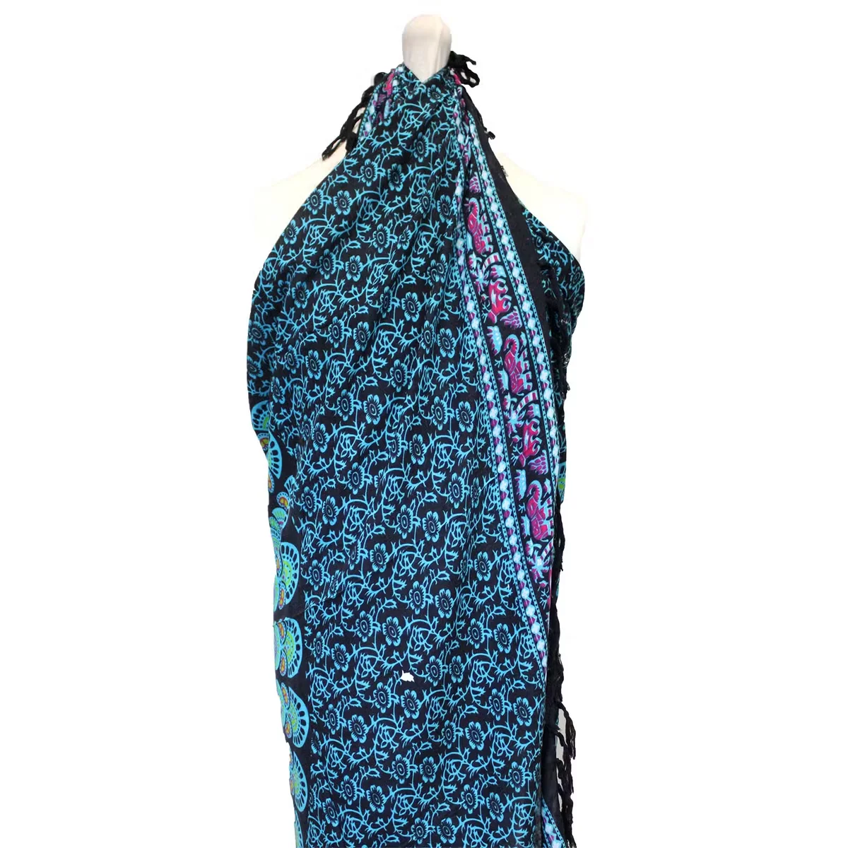 Colourful sarong featuring a peacock mandala pattern in vibrant blues and greens.