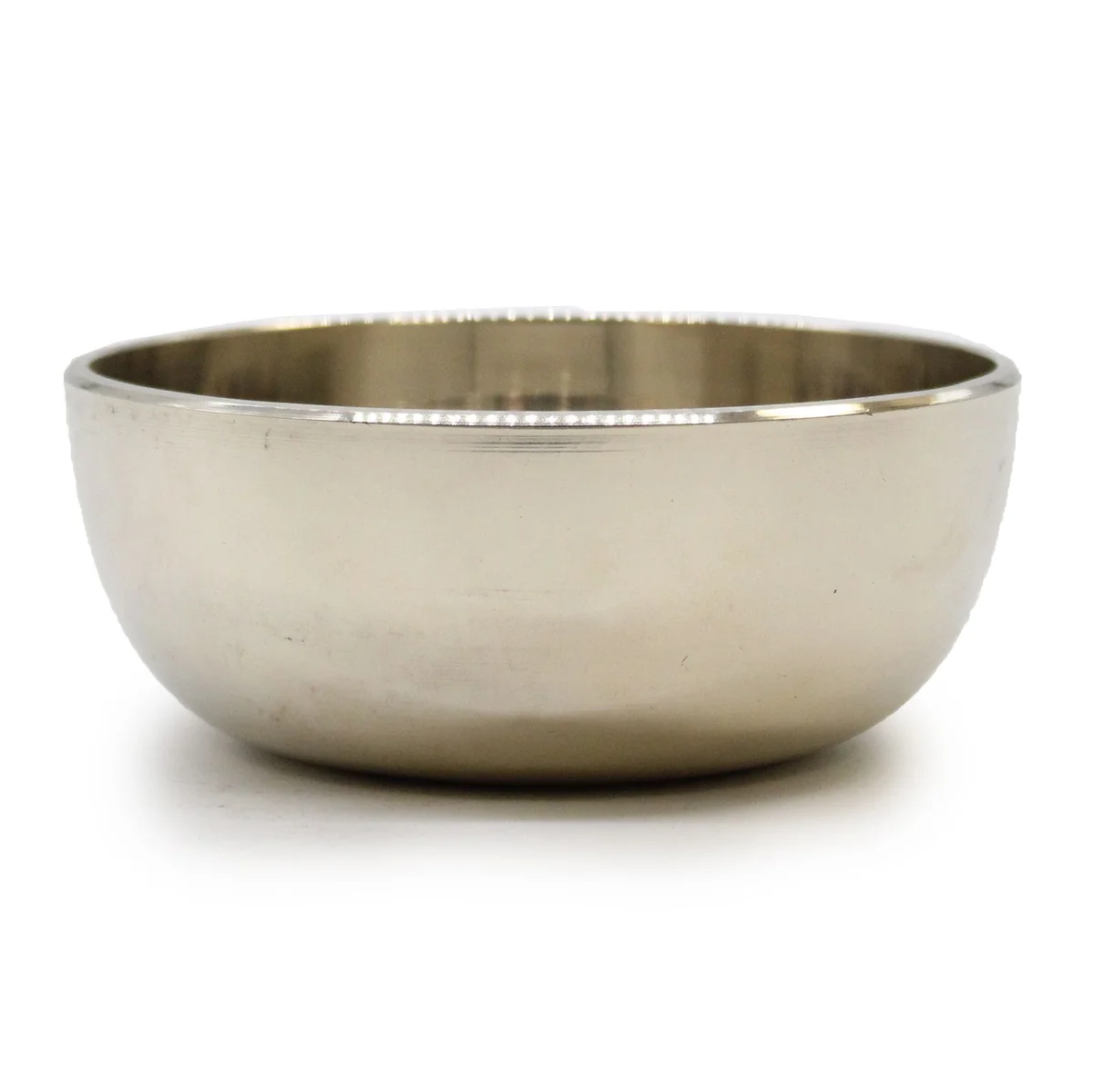 Medium brass sing bowl, 12 cm tall, displayed upright on a plain background.