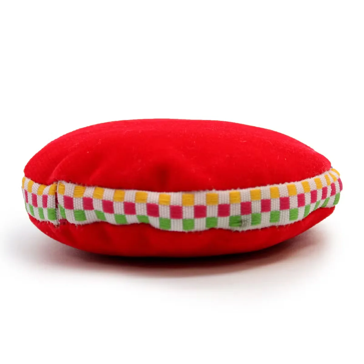 Silky black velvet cushion shaped like a small 7cm singing bowl, wrapped in a soft, plush fabric.