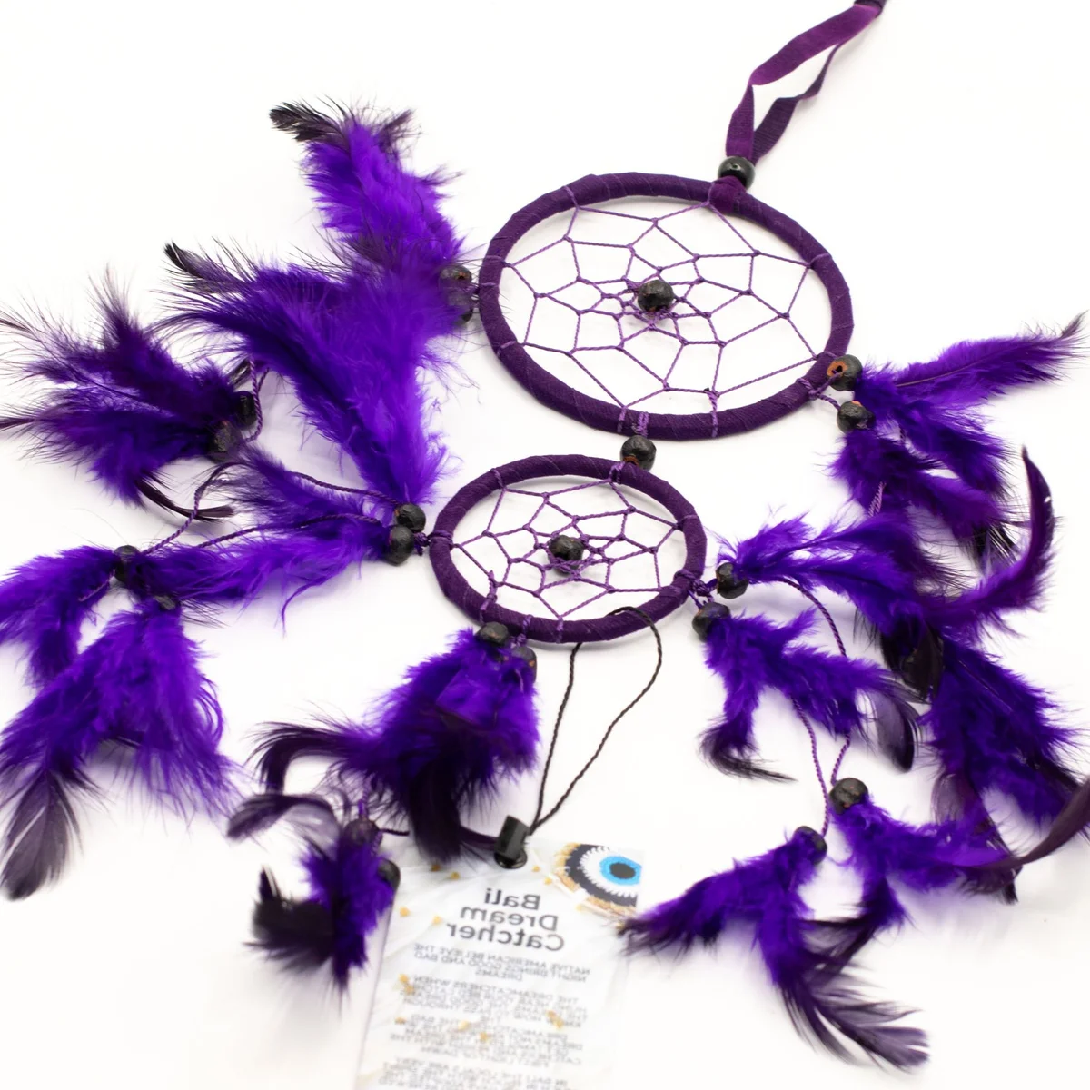 Medium round Bali dreamcatcher featuring turquoise and pink accents, popular turquoise pink decor