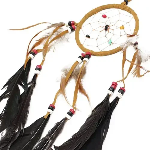 Medium round dreamcatcher in cream, coffee and chocolate tones, woven with intricate netting and feathers.
